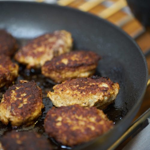 frikadeller or danish meatballs on frying pan