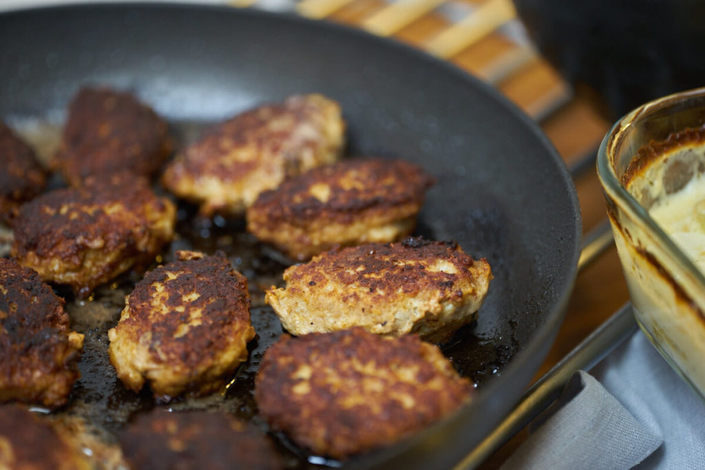 frikadeller or danish meatballs on frying pan