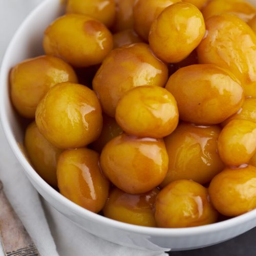 Danish caramel potatoes in white bowl