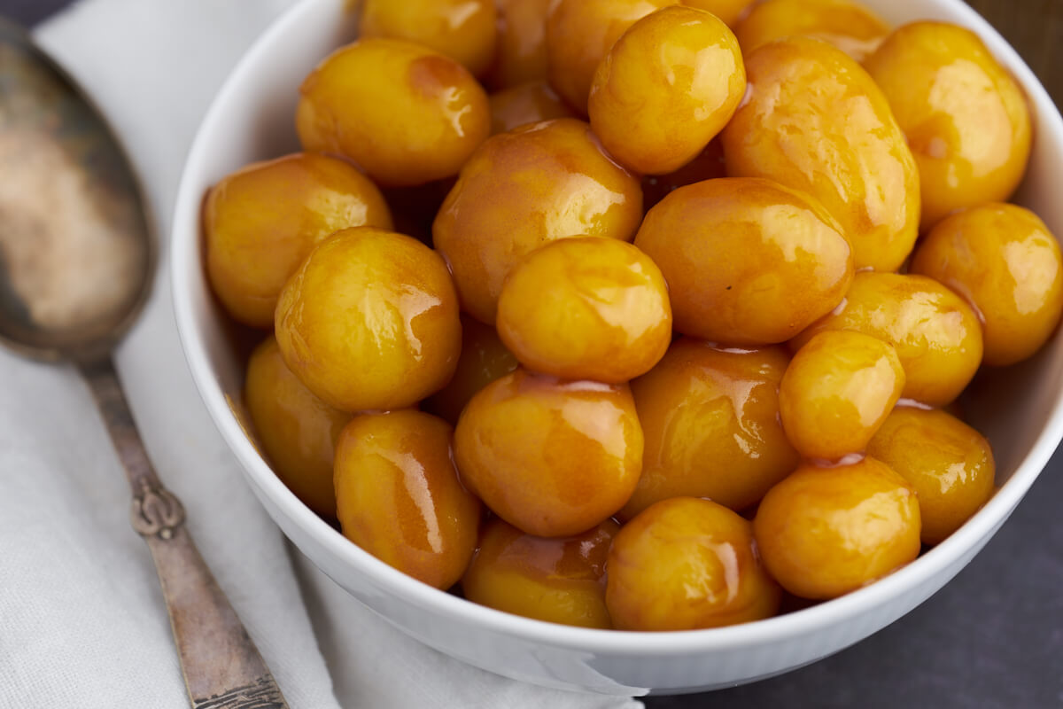 Danish caramel potatoes in white bowl