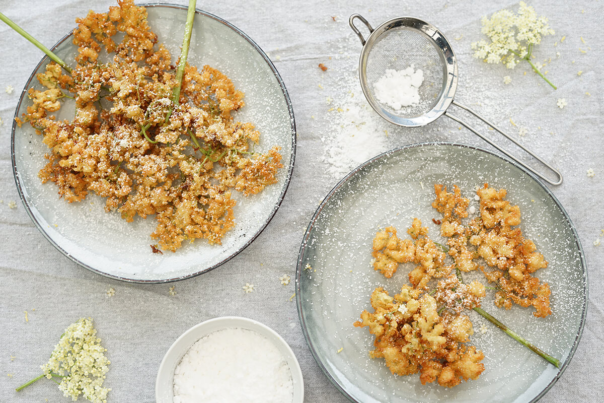 danish dessert elderflower fritters with icing sugar