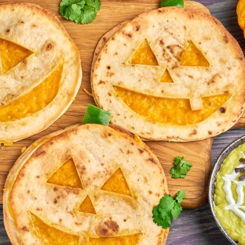 Jack o Lantern quesadillas for halloween with spider guacamole