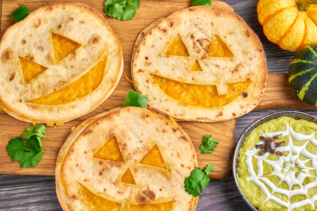 Jack o Lantern quesadillas for halloween with spider guacamole