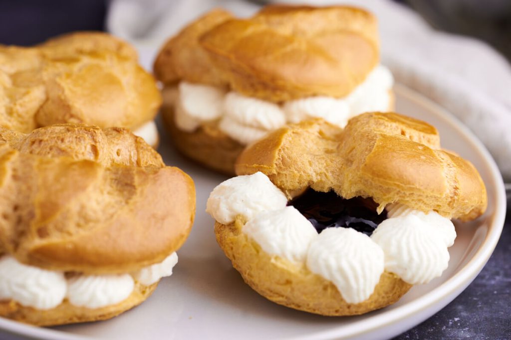 danish choux buns with whipped cream and jam