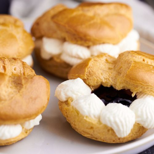 danish choux buns with whipped cream and jam