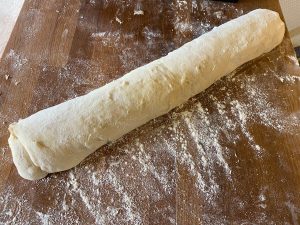 The dough with the filling rolled up
