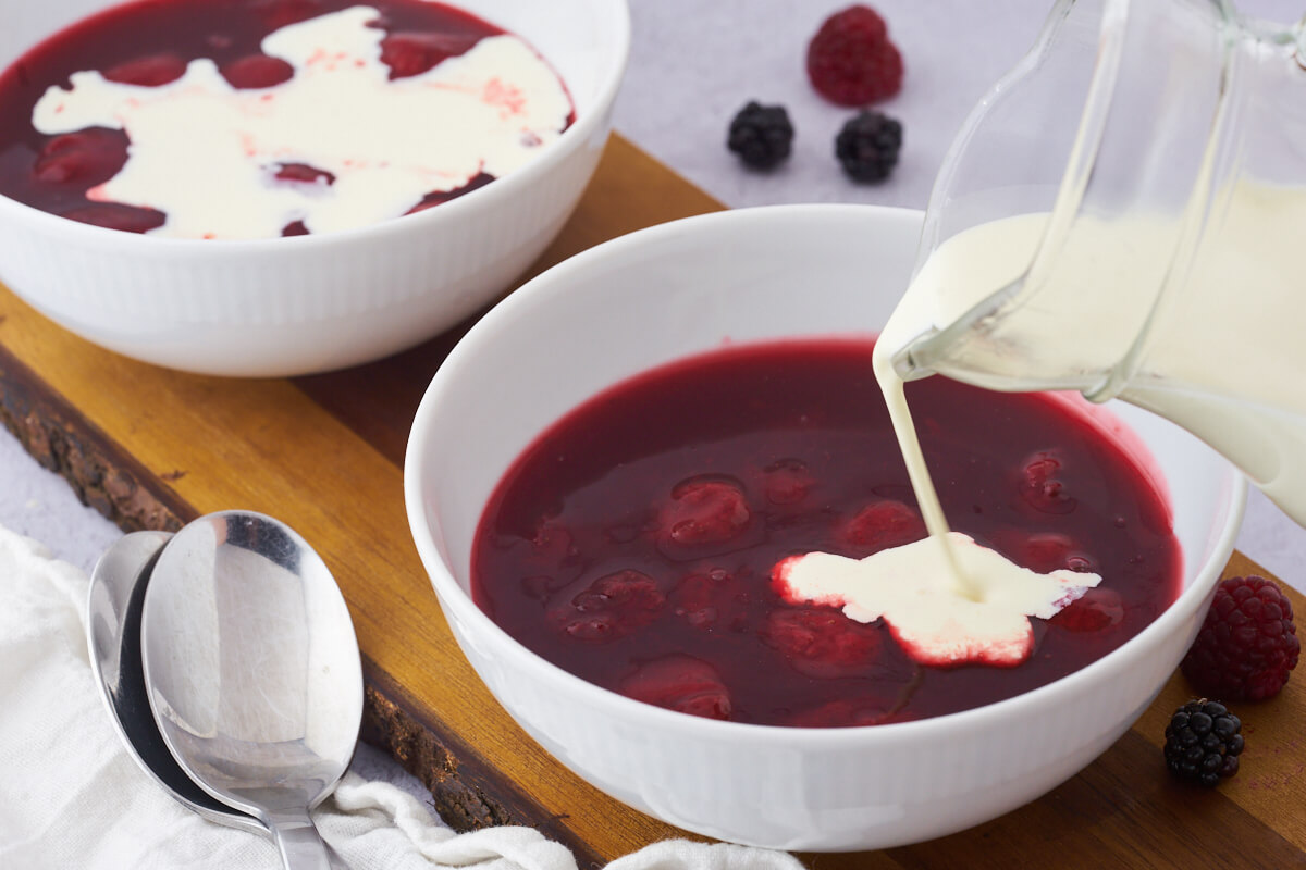 danish red berry pudding with strawberries and cream