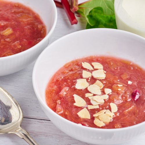 traditional danish rhubarb pudding with cream and almonds