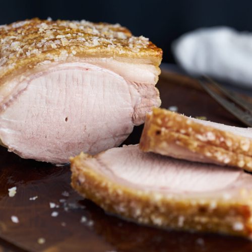 danish roast pork with crackling on wooden board