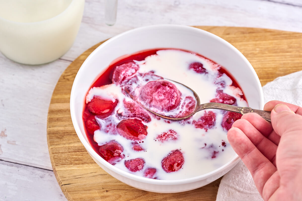 bowl of danish strawberry pudding with a spoon