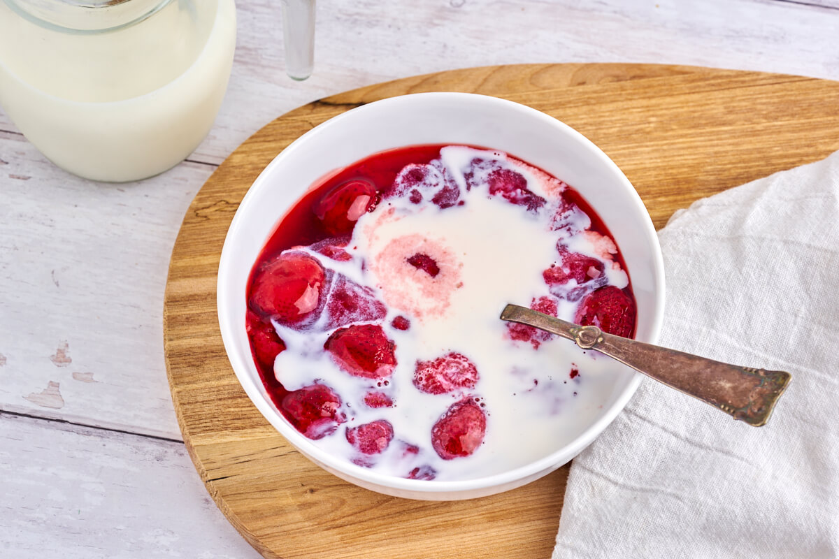 bowl of danish strawberry pudding with cream