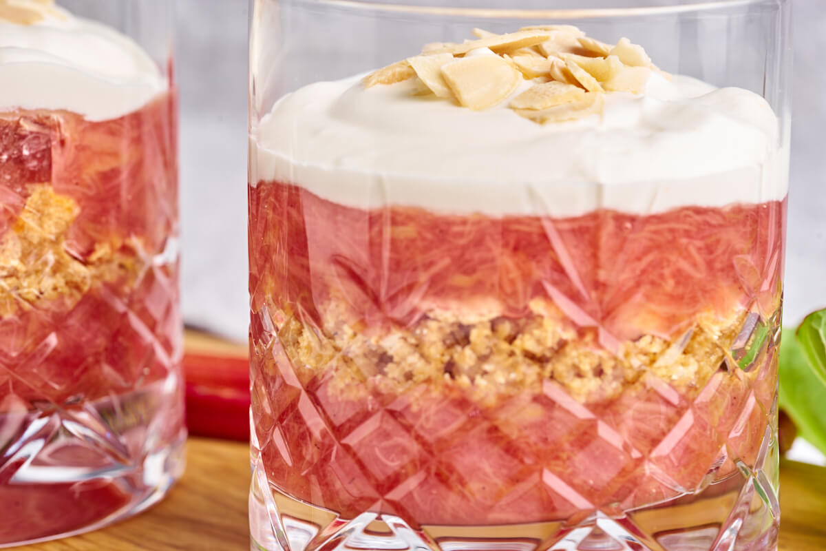 layered old-fashioned danish rhubarb cake with almonds on top