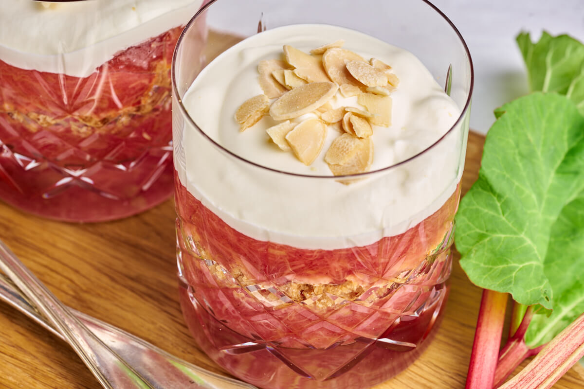 Danish old-fashioned rhubarb cake with rhubarb pudding, crumble and whipped cream