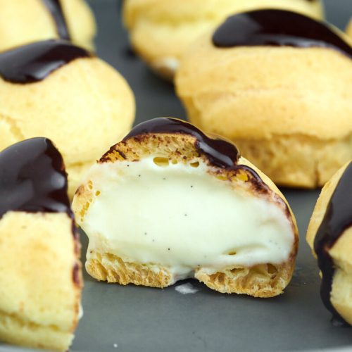 small profiteroles with pastry cream and icing