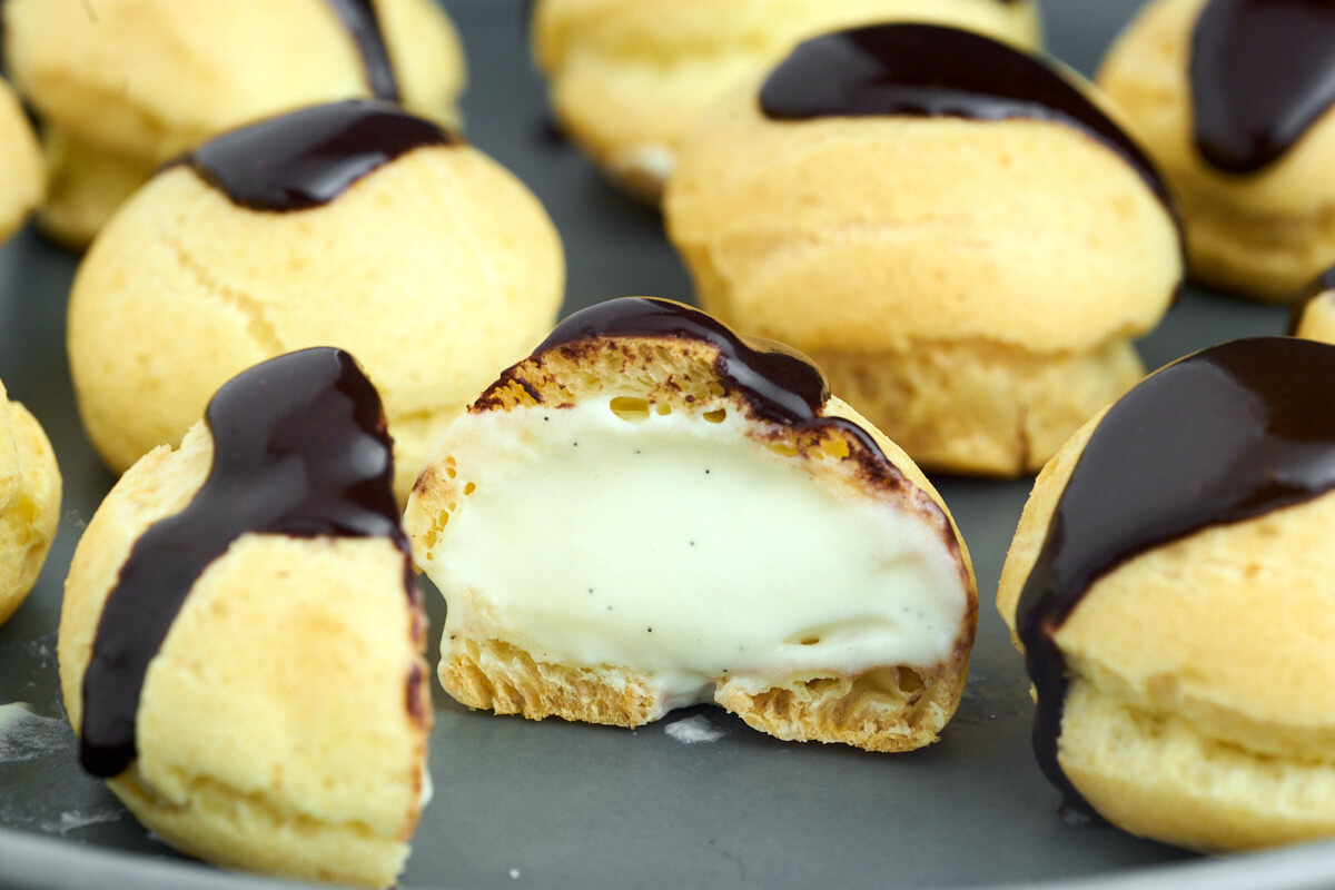 small profiteroles with pastry cream and icing