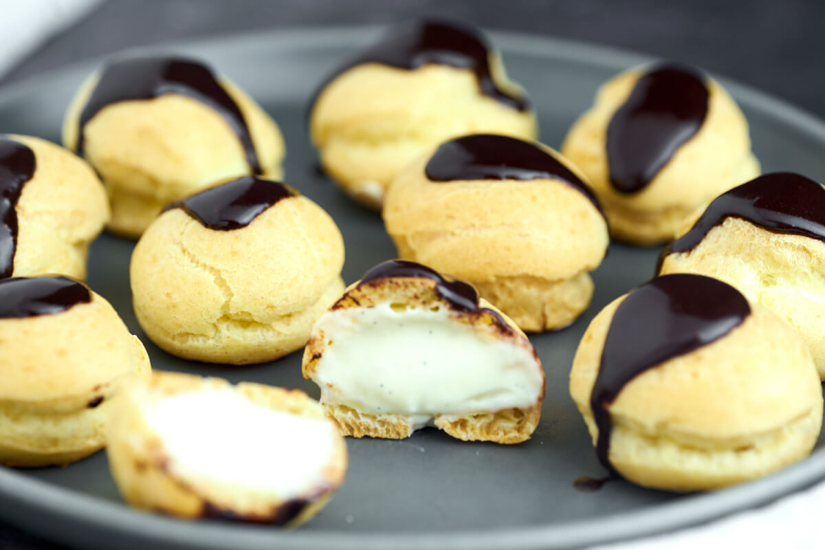 plate with profiteroles with light vanilla pastry cream