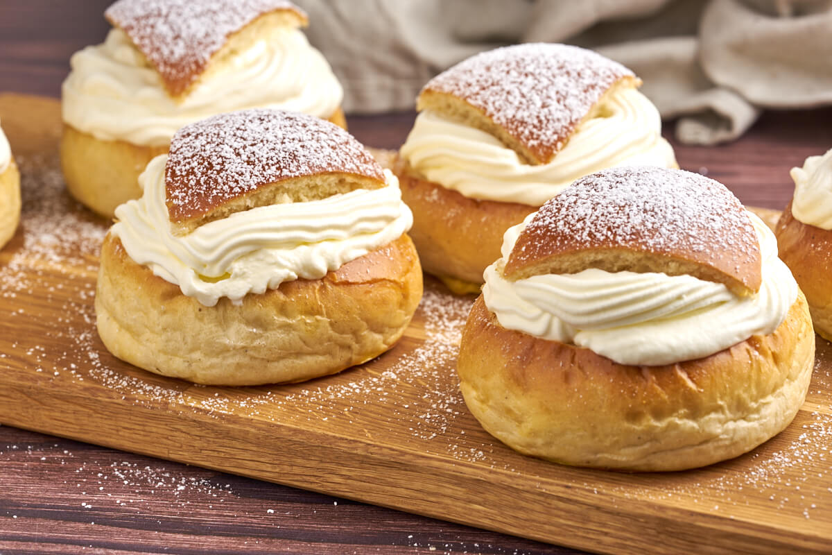 swedish shrovetide buns on wooden tray