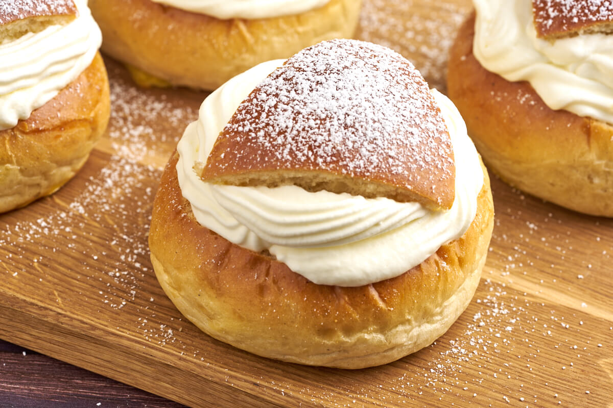 Swedish fastelavnsboller with marzipan almonds and whipped cream