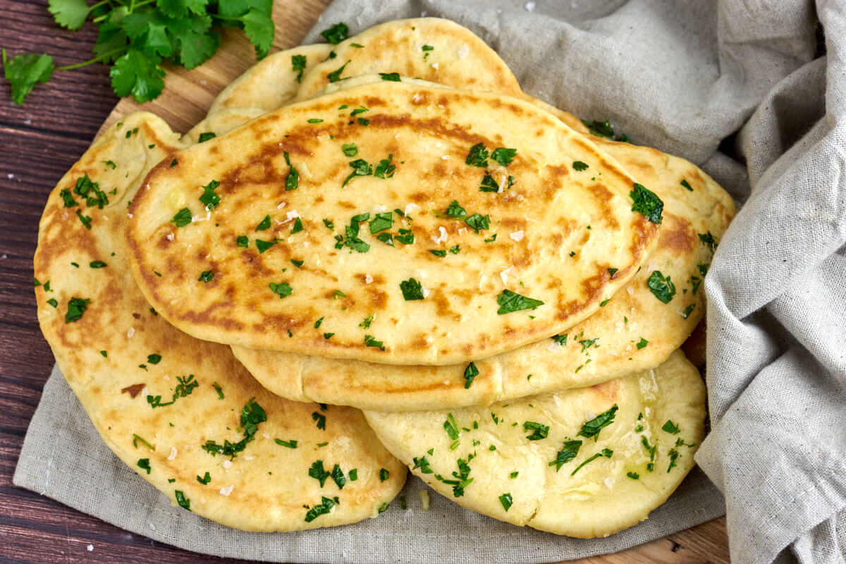 Indian garlic naan bread with coriander leaves and salt