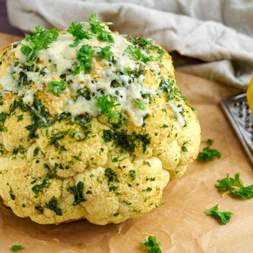 Whole roasted cauliflower with parsley and lemon and cheese