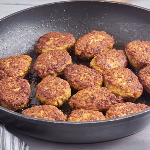 danish chicken meatballs in frying pan