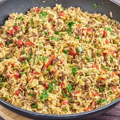 ground beef fried rice with bell pepper in frying pan