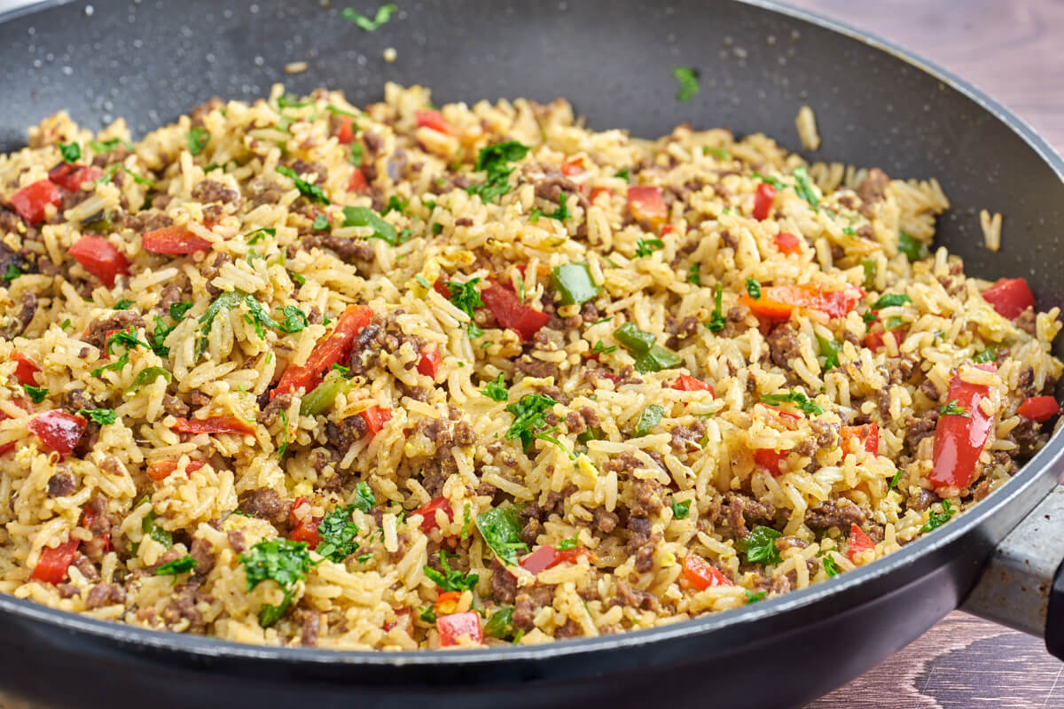 pan with fried rice with ground beef and bell peppers