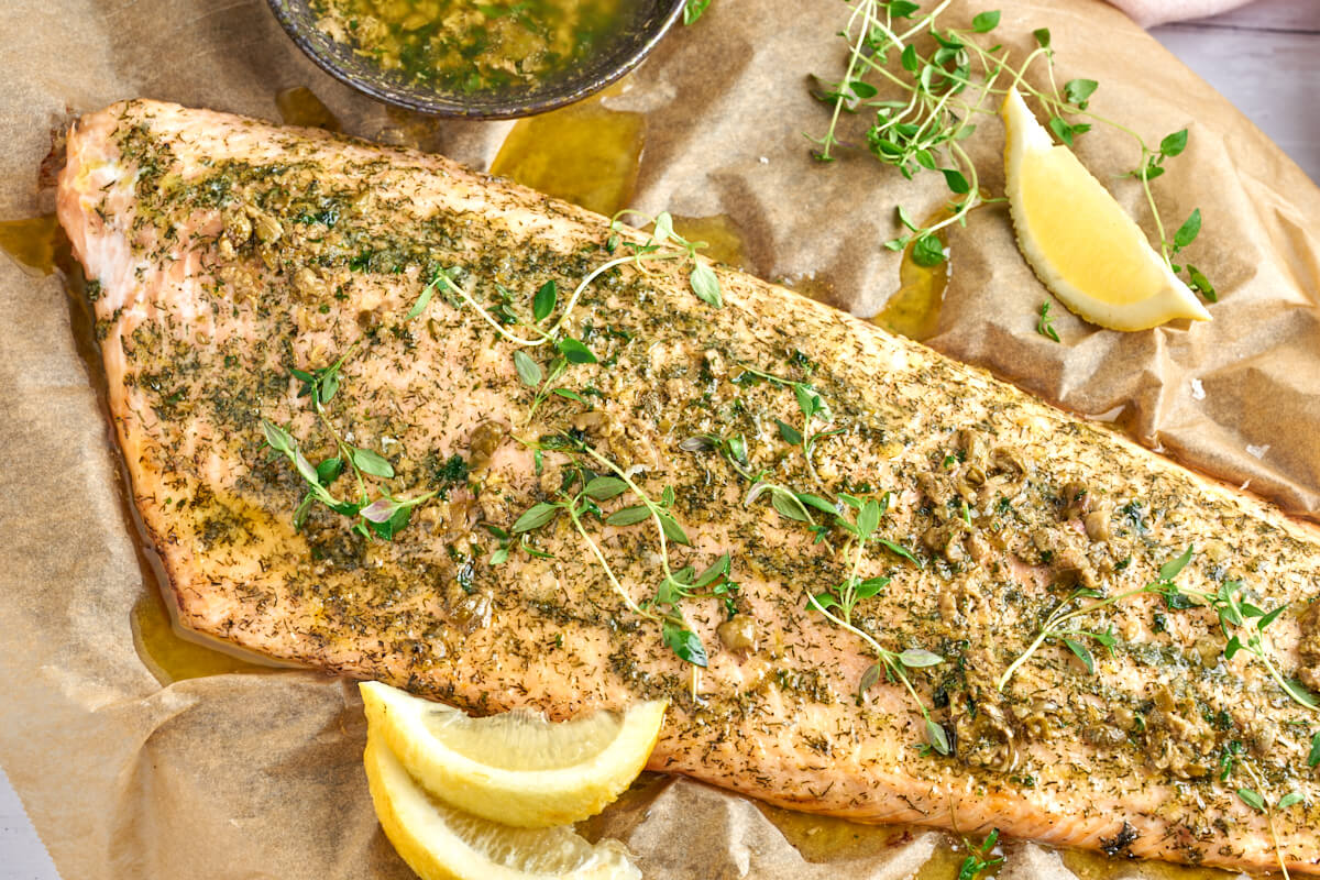 baked salmon with butter sauce and herbs