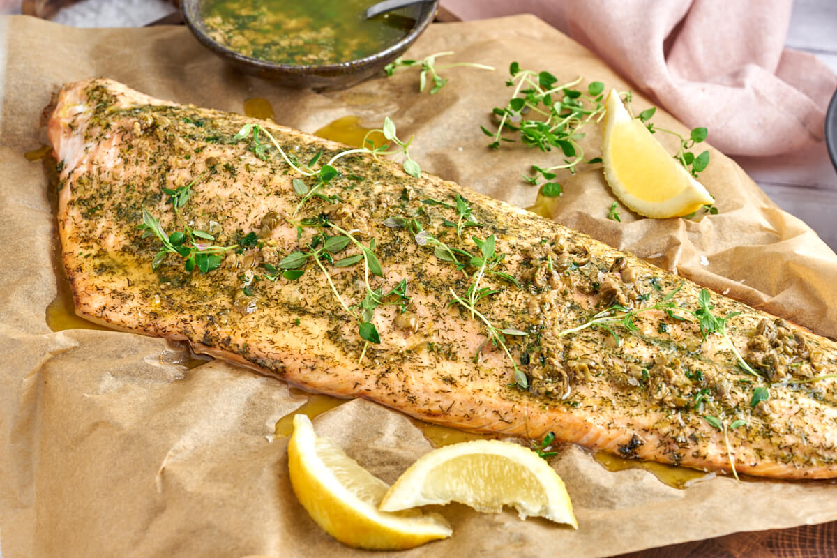 baked salmon with herbs and lemon served with browned butter sauce