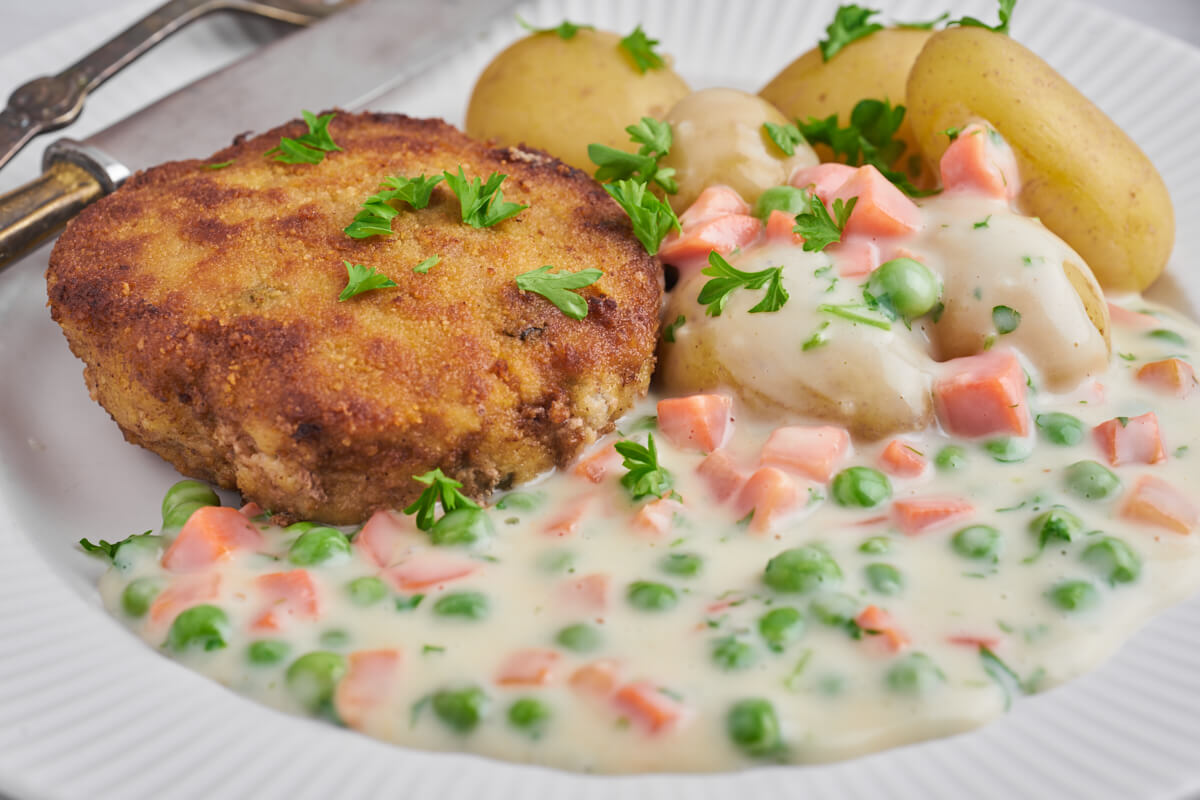 danish breaded pork patties with stew and potatoes
