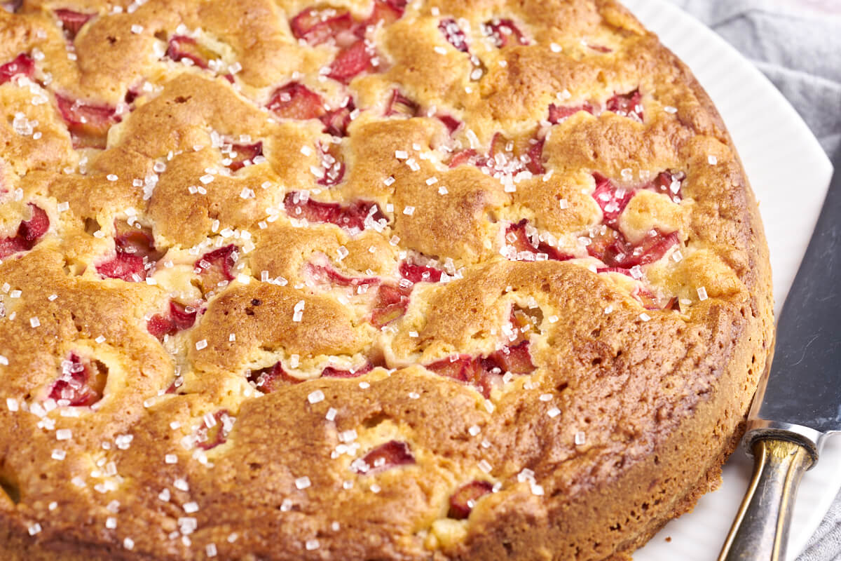 danish rhubarb cake on plate with knife