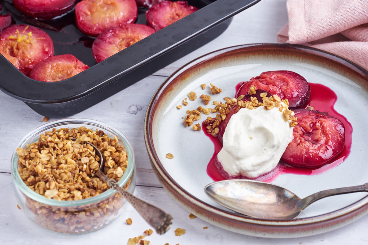 baked plums with crumble and whipped cream