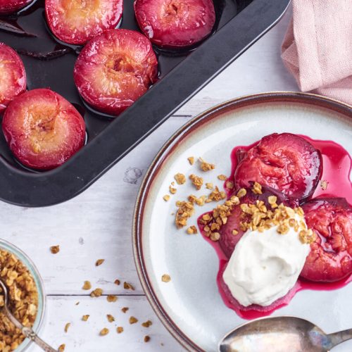 baked plums with crumble and whipped cream