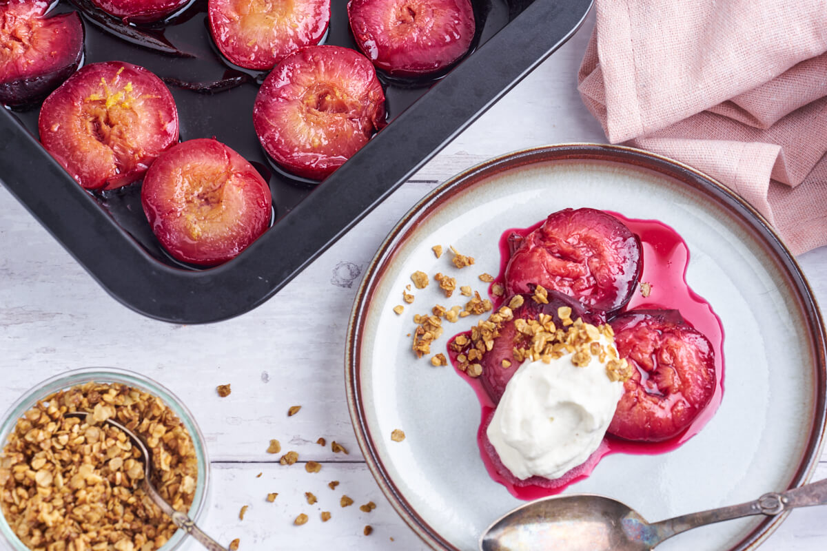 baked plums with crumble and whipped cream