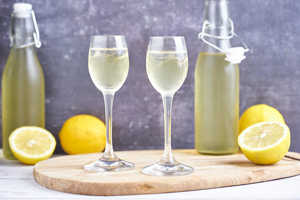 two bottles and to glasses with italian limoncello