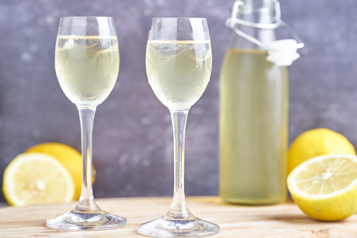 Italian limoncello in glasses and a bottle of lemon liqueur
