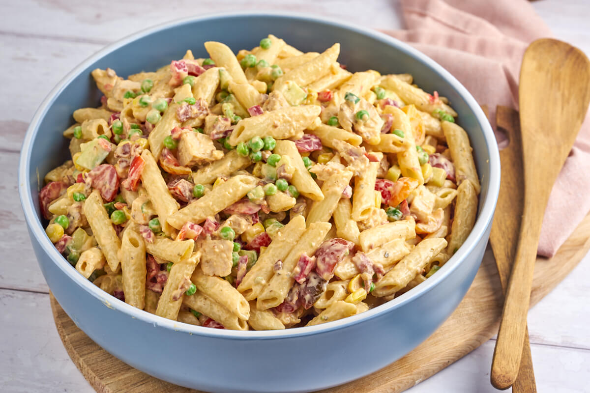 pasta salad with chicken and bacon in blue bowl