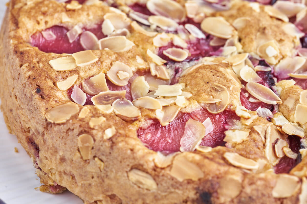 homemade plum cake with almond flakes