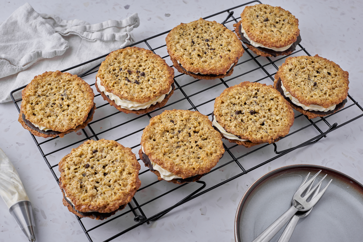 oatmeal cookies with buttercream on baking rack