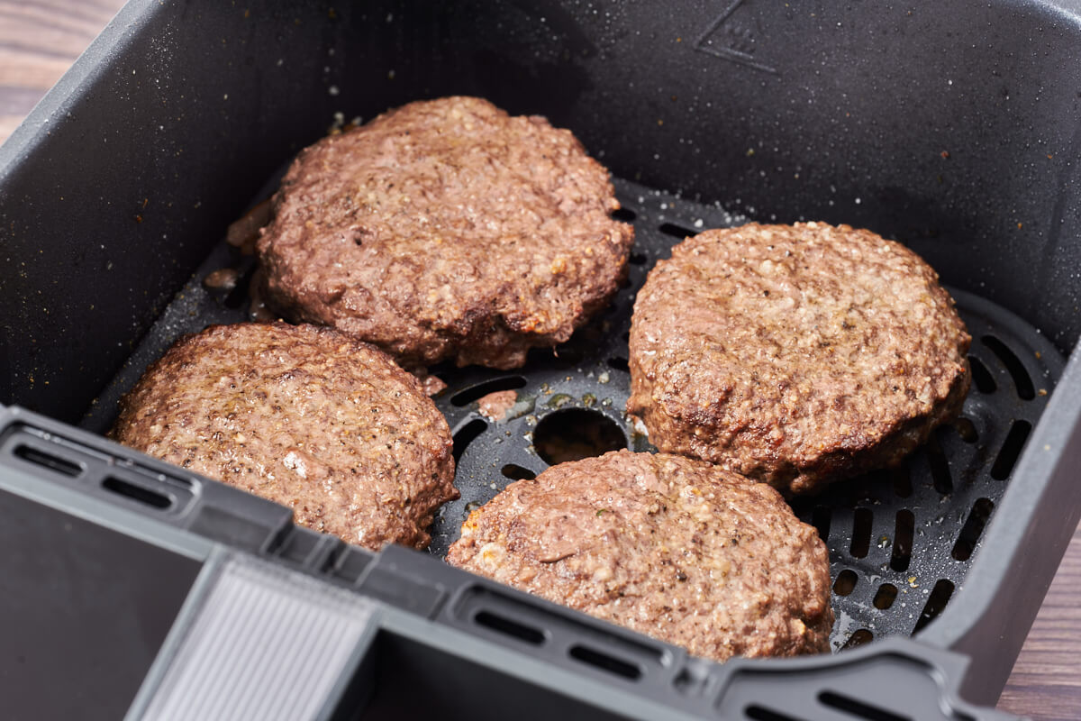 Air fryer hamburgers in basket