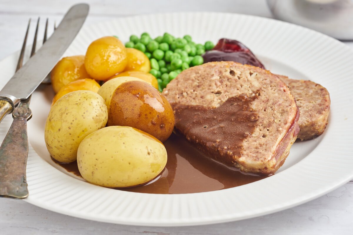 Plate with danish meatloaf, gravy and potatoes