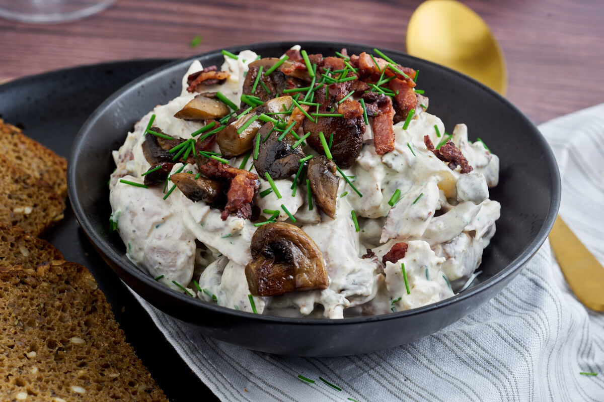 bowl with danish chicken salad with bacon and mushrooms