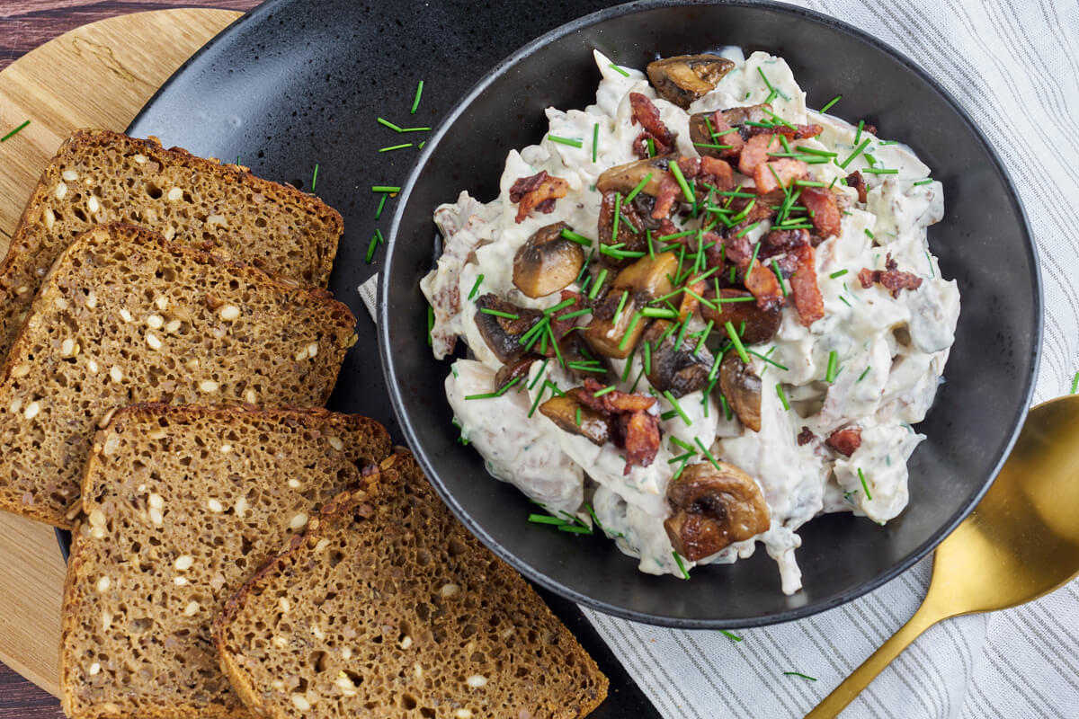 bowl with chicken salad with bacon, mushrooms and asparagus