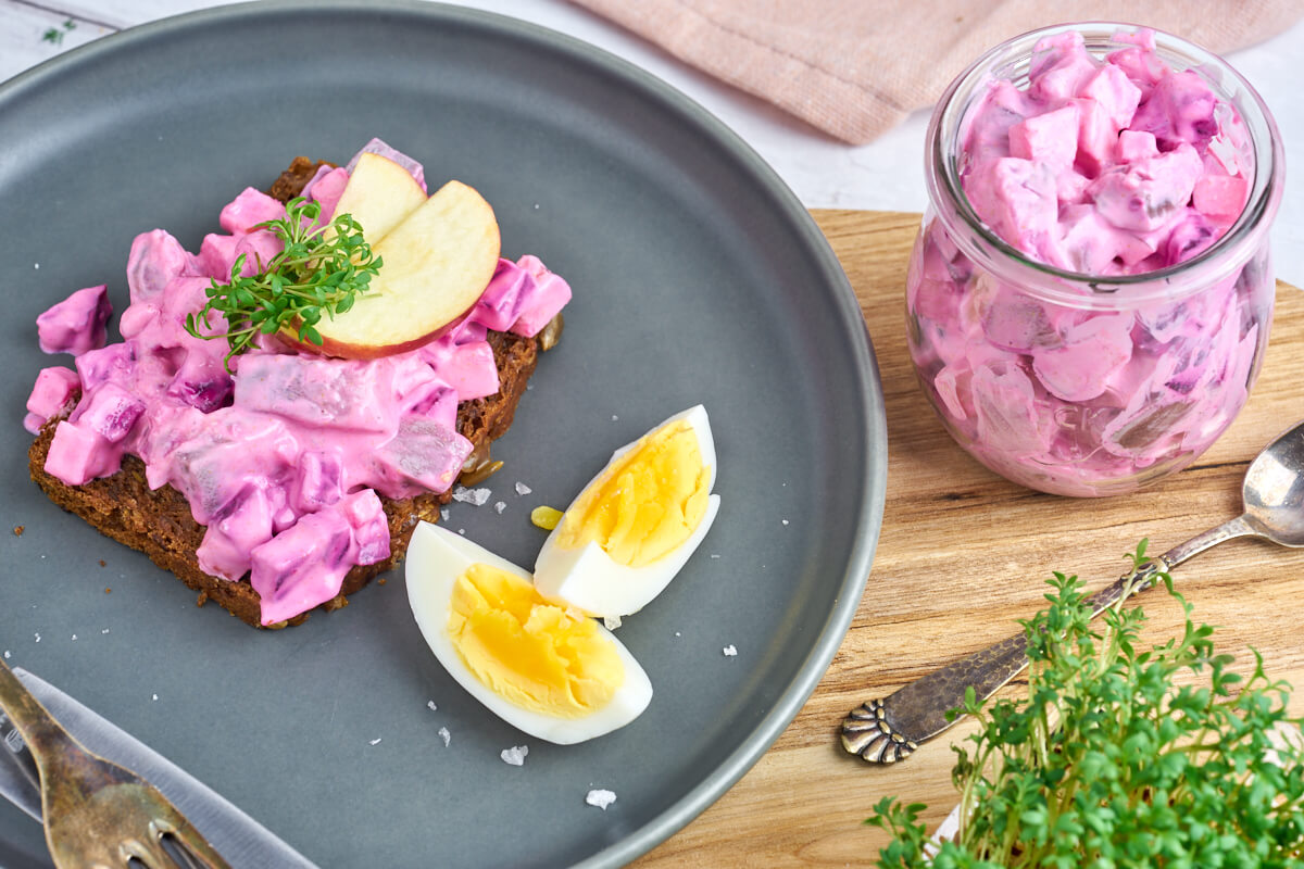 danish herring salat served with bread and boiled eggs