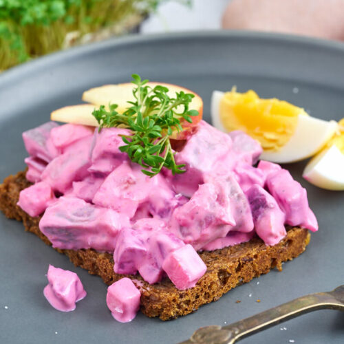 Danish herring salad on rye bread with boiled egg end cress