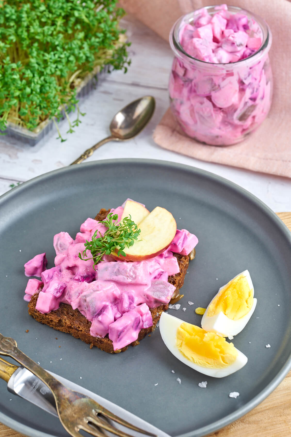 herring salad with beets and apple on danish rye bread