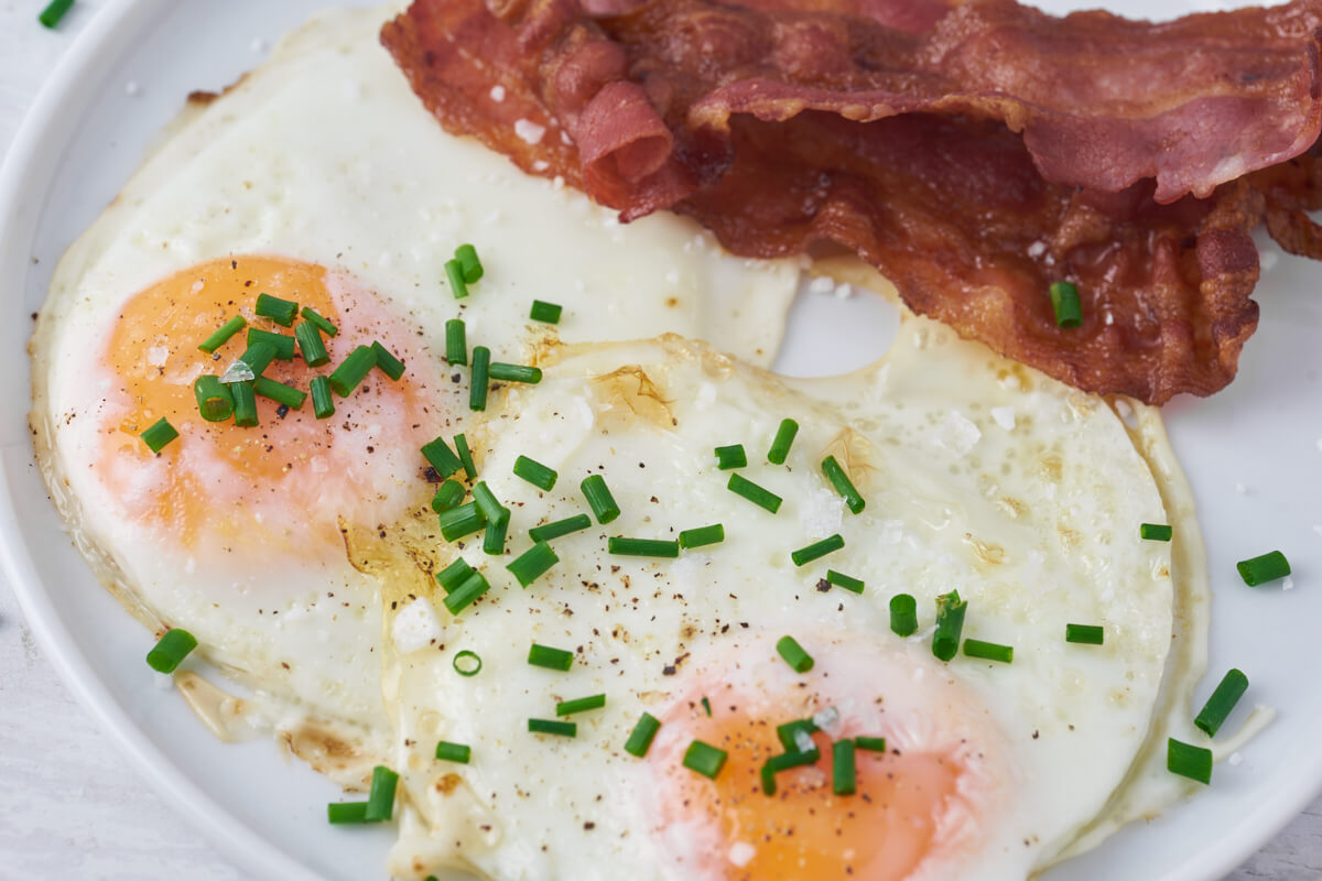 fried eggs in air fryer with bacon