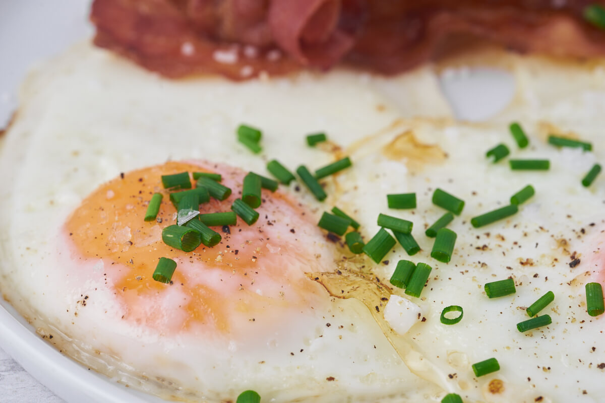 fried egg with salt, pepper and chives