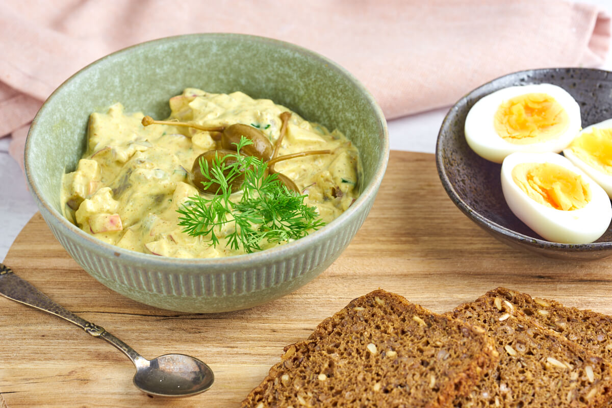 lunch with danish rye bread and marinated herring in curry and eggs