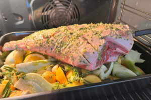 leg of lamb on potatoes and fennel in oven